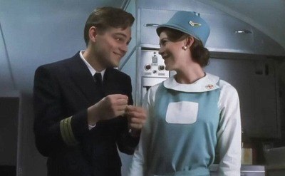 Leonardo DiCaprio talking to Ellen Pompeo in a scene from Catch me if you Can