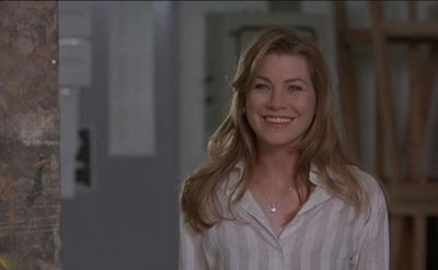 Ellen Pompeo smiling in a scene from Art Heist
