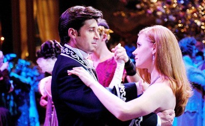 Patrick Dempsey dancing with Amy Adams at a ball in a scene from Enchanted
